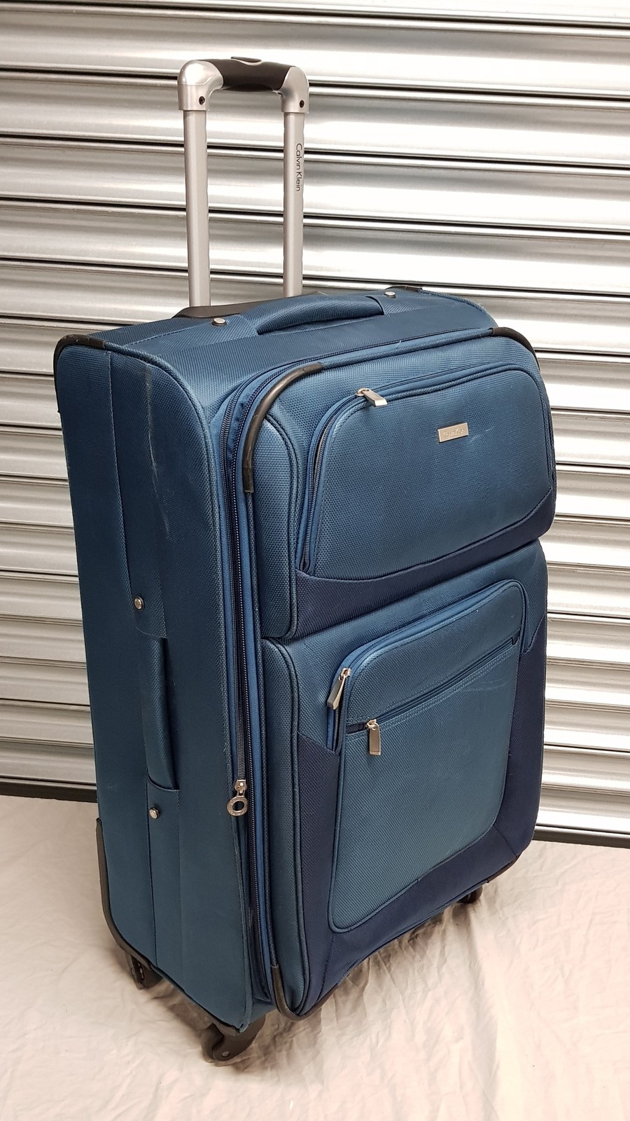 Maleta giratoria de diseñador azul Calvin Klein - grande