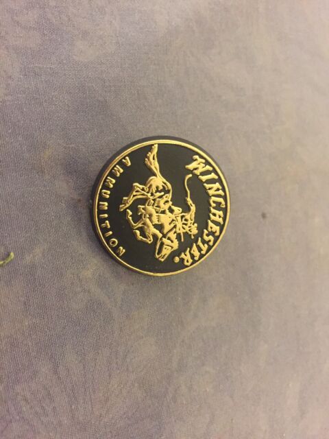 Winchester Ammunition black and gold plastic advertising pin back Winchester Ammunition black and gold plastic advertising pin back