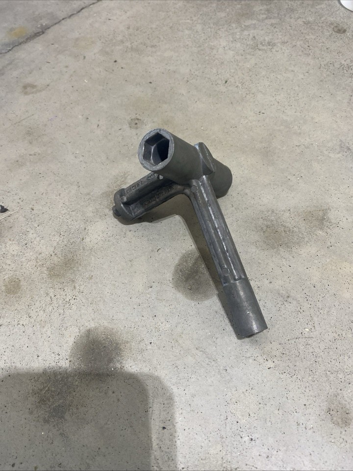 A genuine vintage Fix Stix skate tool shaped like a key — a tiny piece of skate culture history that still works and fits on a keychain.