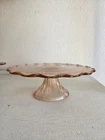 Vintage pink depression glass cake stand Leaf scalloped edge radiant pattern 10"