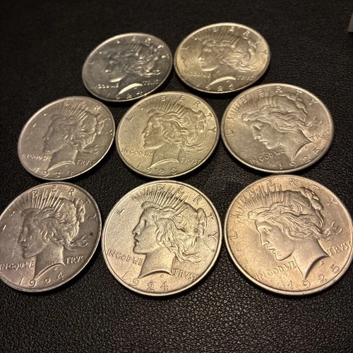 8 Peace Silver Dollars All In XF Condition. Great Deal.