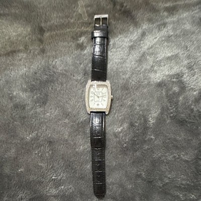 Nolan Miller Quartz Analog Wristwatch Silver Tonneau Case Black Leather Strap