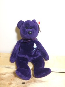purple beanie baby with white rose