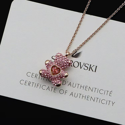 Swarovski crystal teddy bear necklace for women, featuring a beating heart
