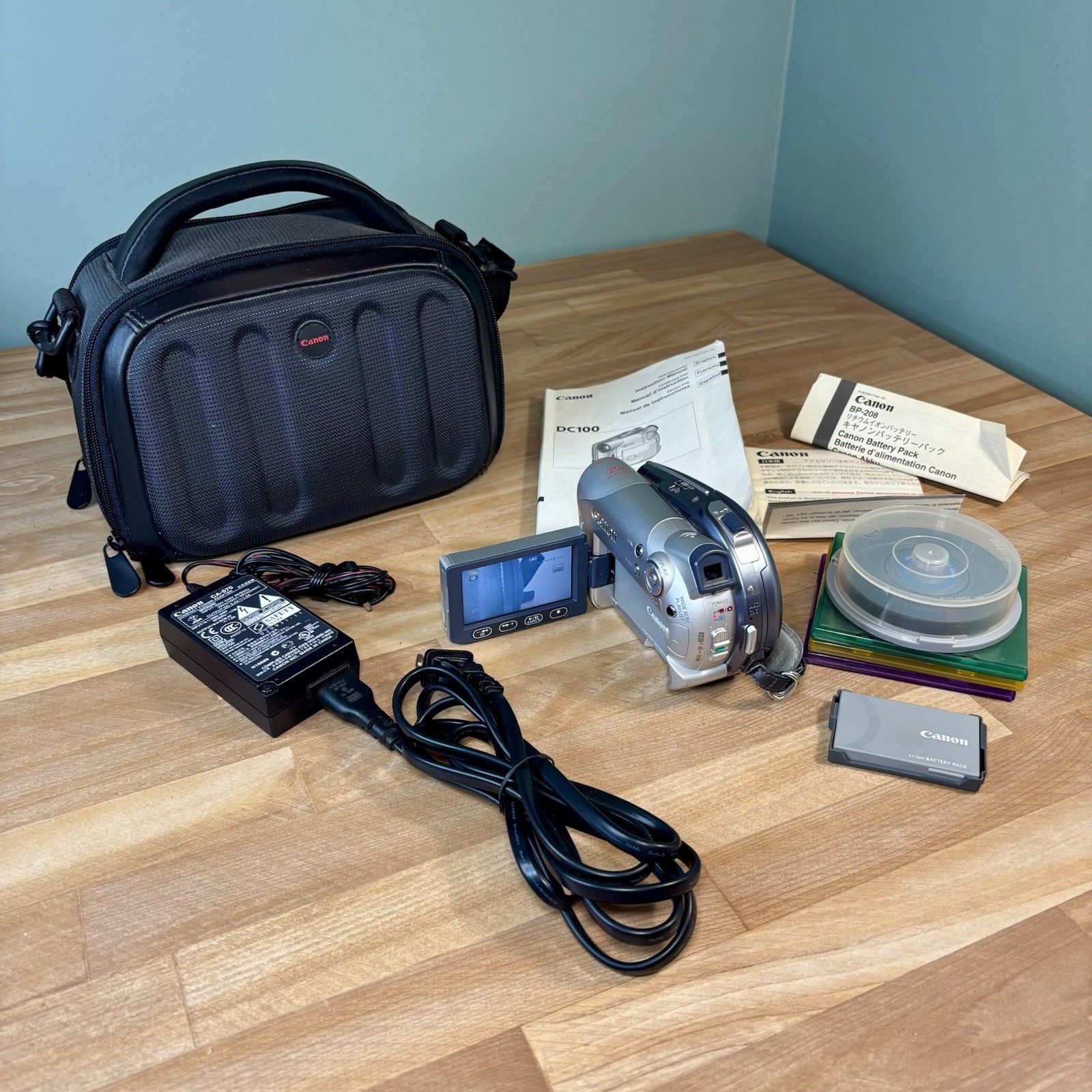 Camera W/ 2 Batteries, Charger, 5 Dvds, Case, Manuals