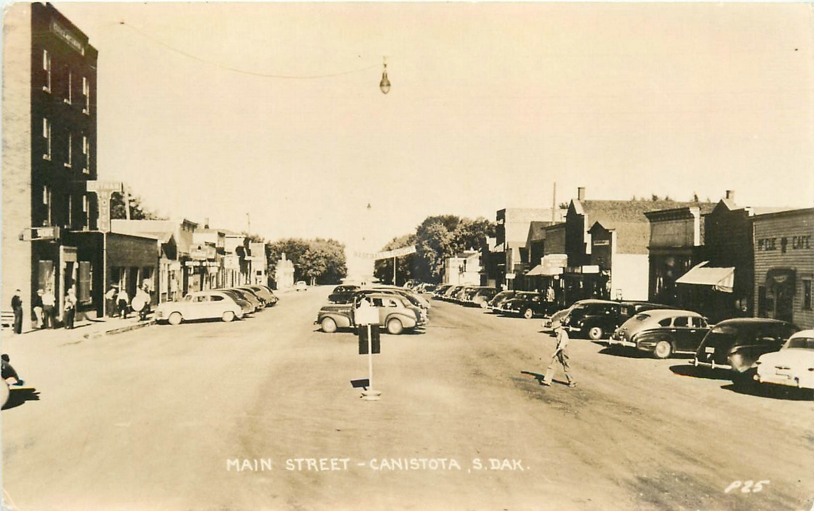 1940s Canistota South Dakota Main Street people autos RPPC Postcard 25-8088