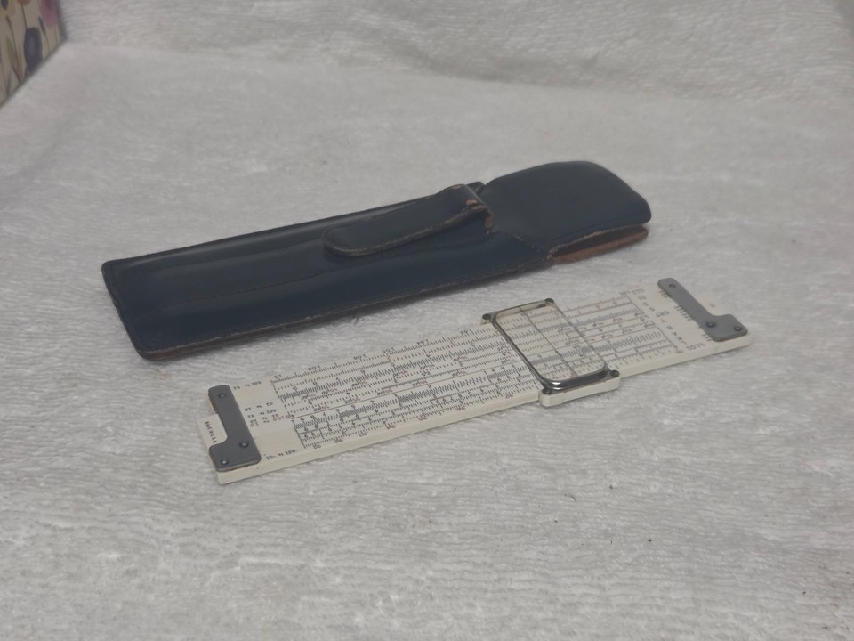 A 1947 Keuffel & Esser 5" slide rule in a leather pocket case — K&E is the Rolls-Royce of slide rule makers and this one predates the transistor.