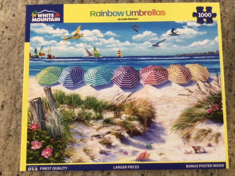 1000 Piece Jigsaw Puzzle by White Mountain Puzzles “ Rainbow Umbrellas”