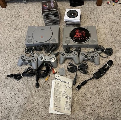 Two PlayStation 1 Consoles Bundle w/ 4 Controllers, Cords, Memory Card, 32 Games