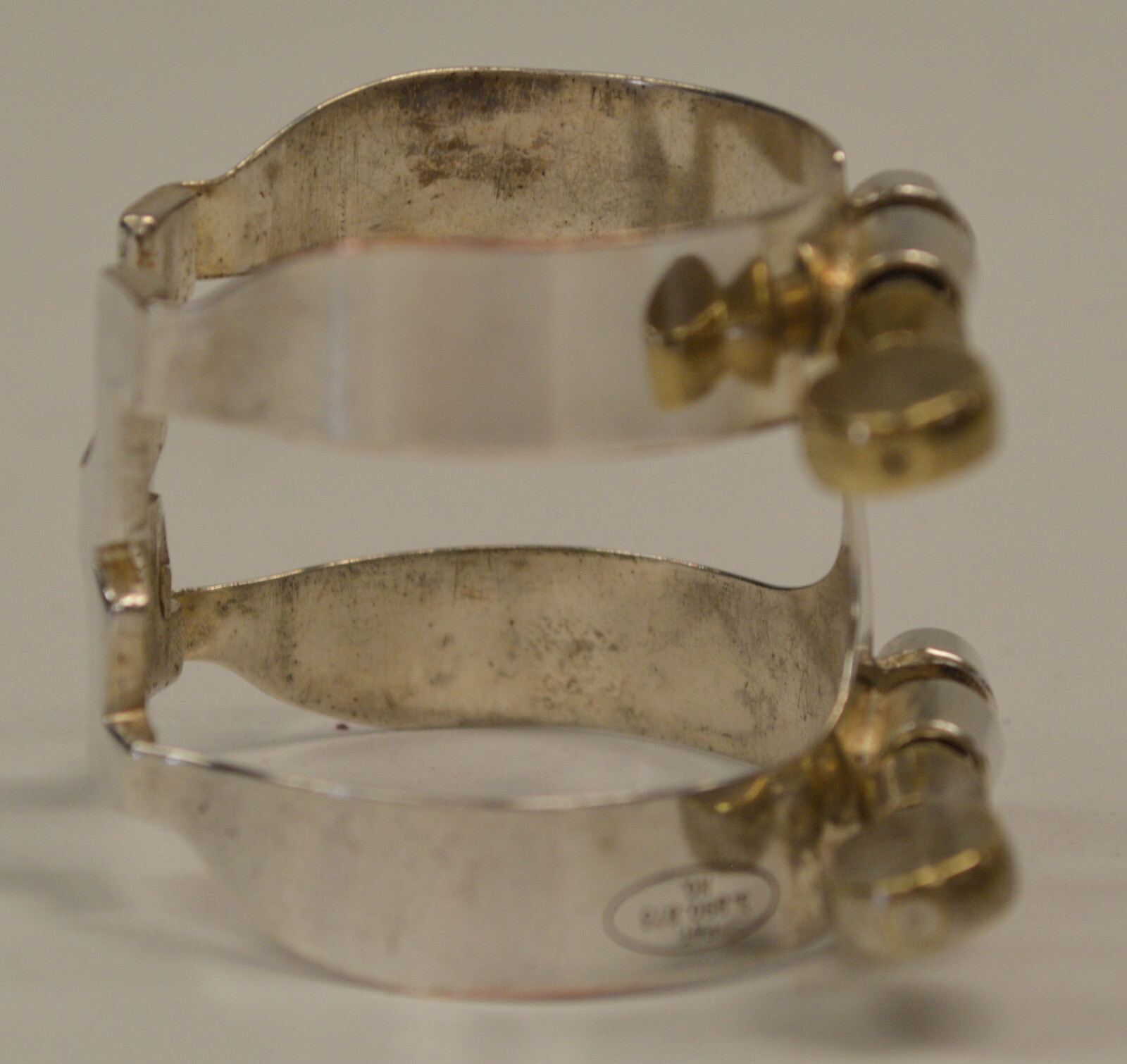 USED VINTAGE HARRISON BARI SAX LIGATURE W/PATENT REFERENCE, MARKED BSL