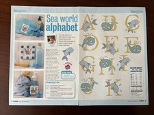 Gráficos de punto de cruz del alfabeto temático del mar **de una revista**