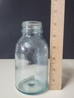 Vintage Mellin’s Embossed Glass Food Jar Green/Blue Tint — photo 1