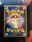 Aerodactyl Japanese holo phantom Pokémon card 009/052 with silver ball design on rainbow foil background.