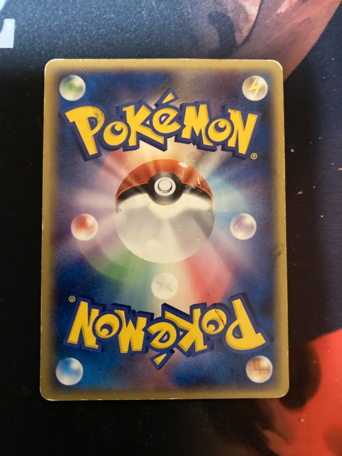 Aerodactyl Japanese holo phantom Pokémon card 009/052 with silver ball design on rainbow foil background.