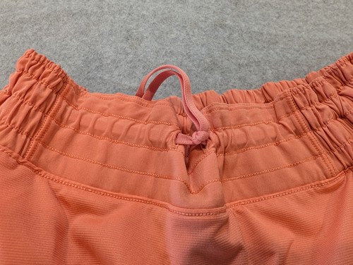 Lululemon Tracker Short Damen 10 orange gefüttert Mid-Rise Reißverschlusstaschen Athleisure - Bild 11 von 14