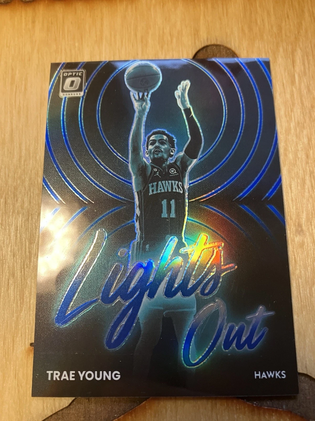 2022-23 Panini Donruss Optic Lights Out Trae Young Blue Prizm /49