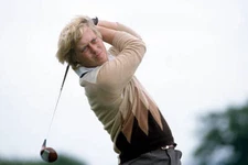 Howard Clark of Great Britain teeing off during the Benson and He - Old Photo