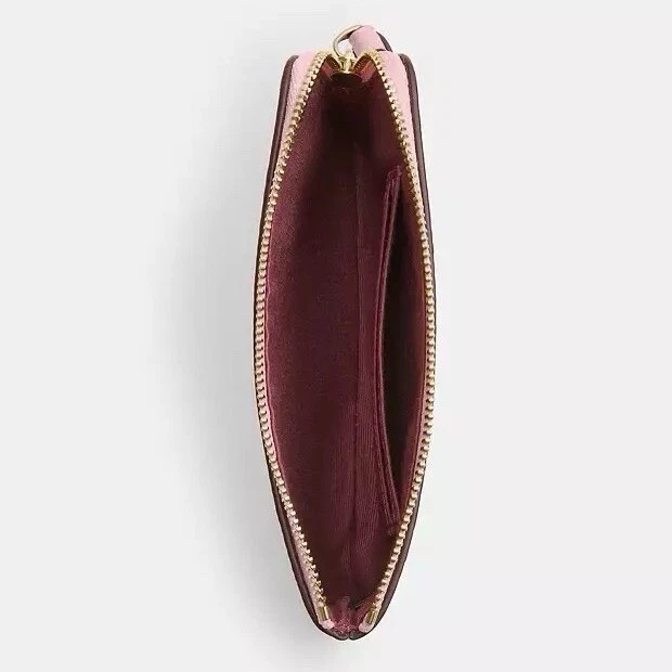 Bracciale Coach con zip angolare nuovo con etichette in tela firmato CAQ75 IM rosa cipria