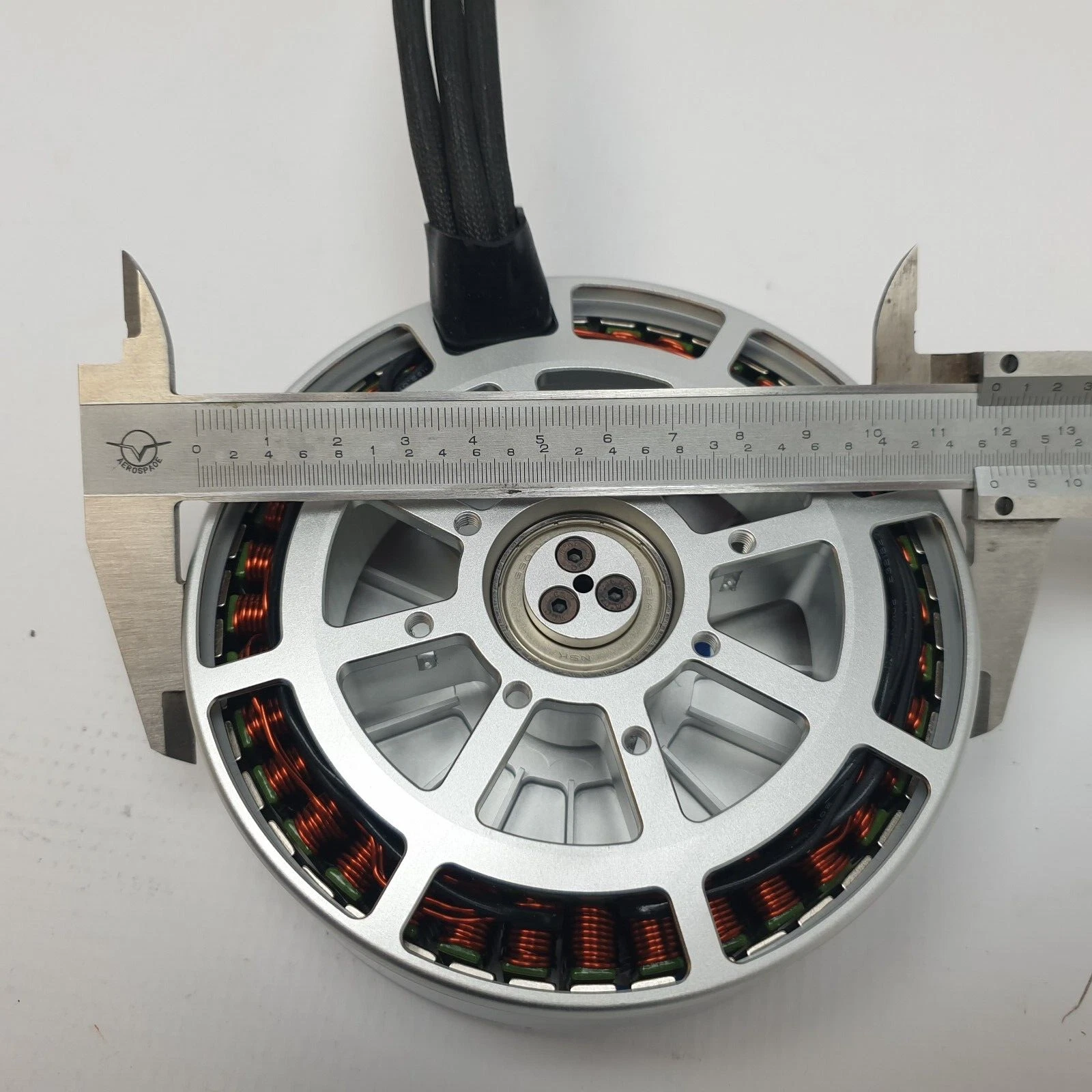 Caliper across the base of the Heven Drones P150 motor