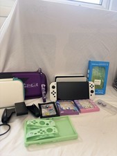 Nintendo Switch OLED Handheld Console - With Pokemon Accessories And Cases