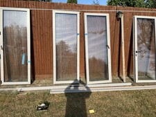 Bi fold doors approx 3.2 m long 2m high few screws missing and no keys.