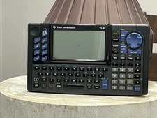 Texas Instruments TI-92 Graphing Calculator TURNS ON But Blue Screen - Has Cover