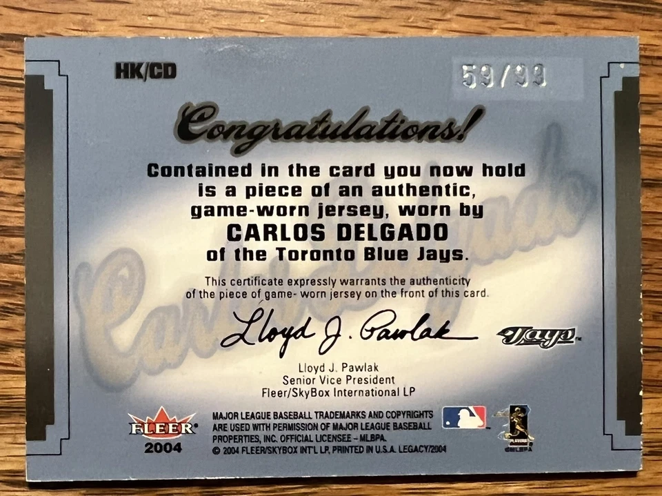 2004 Fleer Carlos Delgado #HK-CD Card. 3 Color Game Worn Jersey SP /99. Blue Jay - Image 2 of 3
