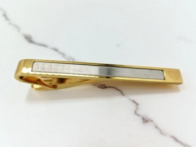 Clip de corbata Dunhill logotipo tono dorado plateado con caja usado Foto 2 de 4