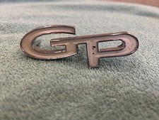 1967 Pontiac Grand Prix Headlamp Door Emblem 9787570 Oem Nos
