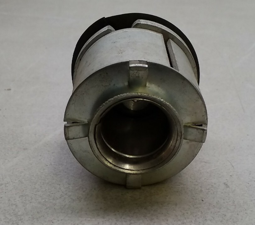 Metal SW105 Filko ignition coil with hexagonal center and polished silver finish, viewed from the rear on a light surface.