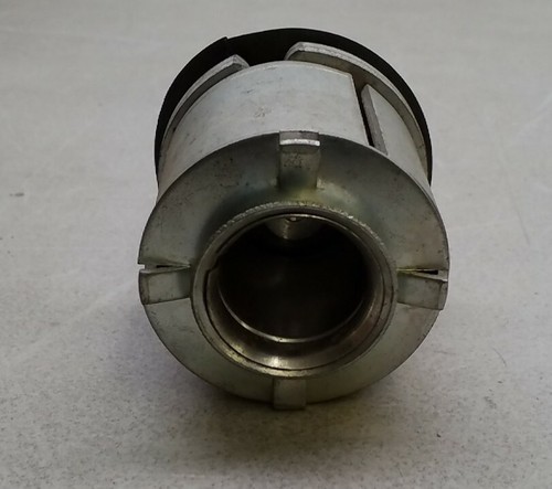 Metal SW105 Filko ignition coil with hexagonal center and polished silver finish, viewed from the rear on a light surface.