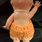 Plastic Baby Doll Blue Eyes Light Complexion No Hair w/ Orange Crocheted Outfit — photo 3
