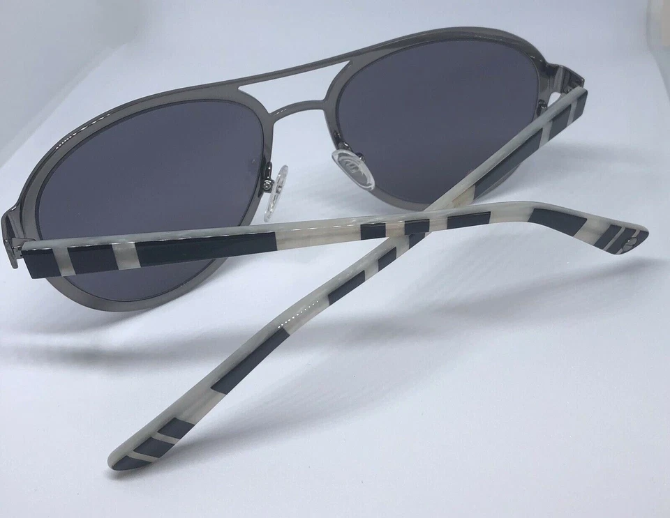 Gafas de sol L.A.M.B con marco plateado y hielo LA556 55-18-140 B:48 lentes espejadas grises Foto 4 de 4