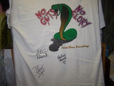 STU , HELEN , BRET HART SIGNED HART BROTHERS TEE SHIRT w/COA