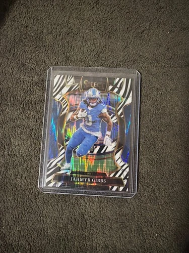 2025 Panini Select Concourse Zebra Shock Prizm Jahmyr Gibbs #71 Detroit Lions