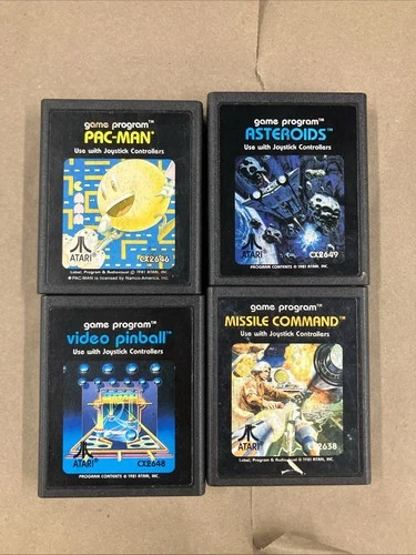 4 Atari 2600 Games. Pac-Man, Asteroids,Missile Command, Video Pinball.