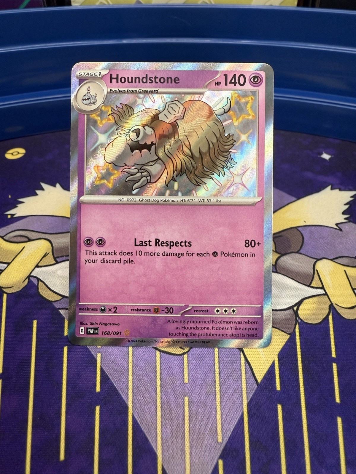 Houndstone 168/091 Sv: Paldean Fates Holo