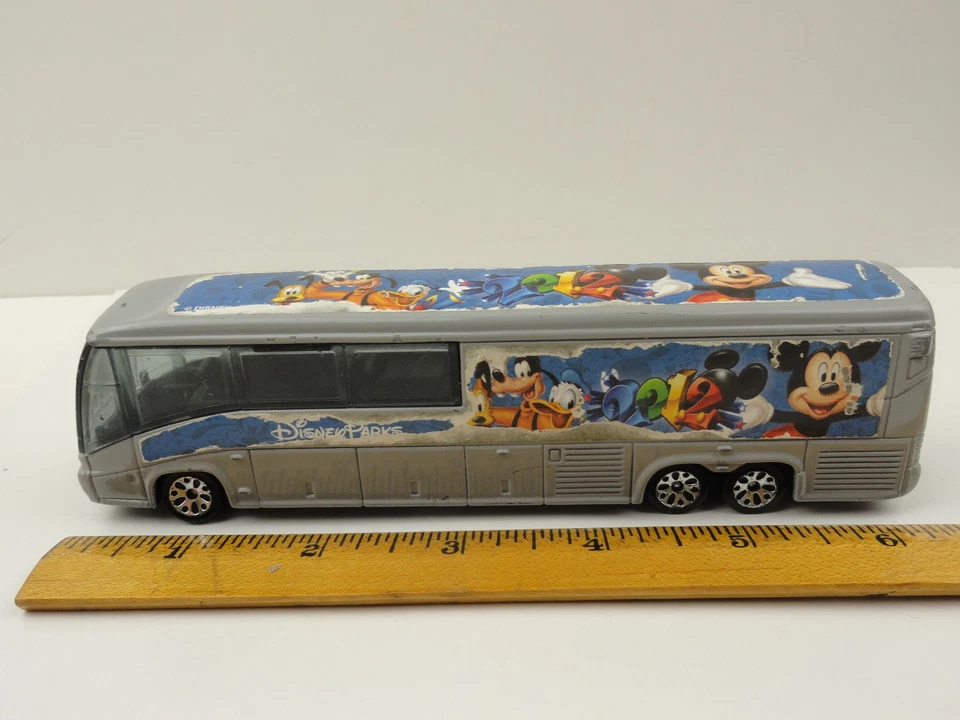 2012 Matchbox Disney Parks Motor Coach Industries Bus (Gray) w/ WEAR - Image 2 of 4