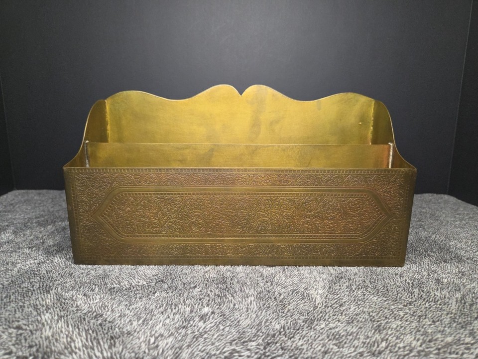 A dramatic Hollywood Regency brass letter rack — the kind of gilded, over-the-top desk piece that anchors an entire room's aesthetic.