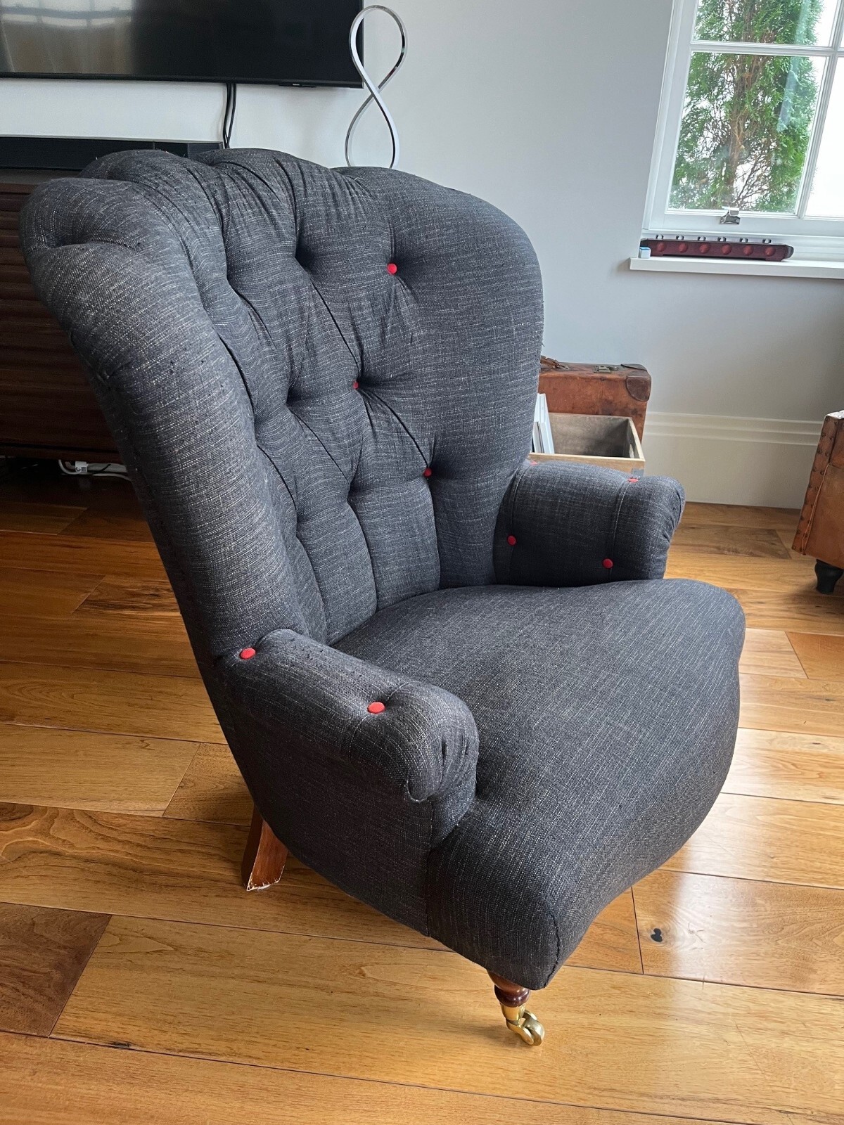 Charcoal low armchair with red buttons eBay