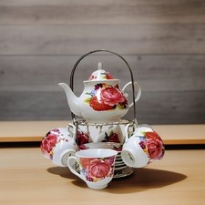 White Rose Ceramic Tea Set with Teapot and Matching Cups on Metal Stand