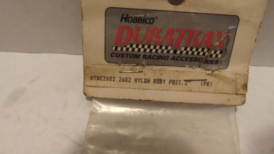 VINTAGE DURATRAX DTXC2602 WHITE NYLON  2" BODY POSTS - Image 2 of 2
