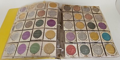 MARDI RAS DOUBLOON ALBUM CONTAINING APPROXIMATELY 273 1960-70's'S VINTAGE COINS