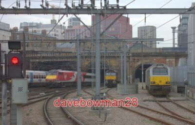 PHOTO  KINGS CROSS STATION NORTH END. CLASS 57 AND 67 DIESEL LOCOMOTIVES IN THE