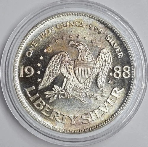 Toned 1988 1oz .999 Silver Life, Liberty Happiness A-Mark Round UNC