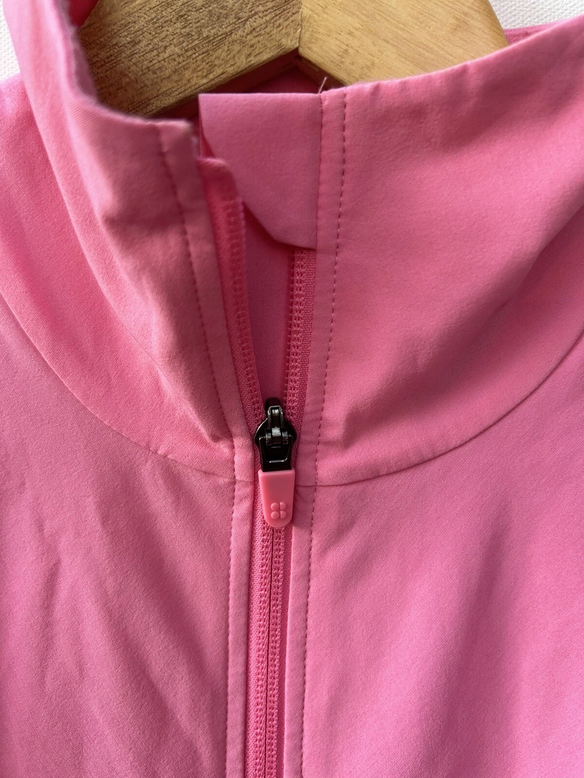 sweaty-betty fast lane windbreaker ruffled zip front workout jacket