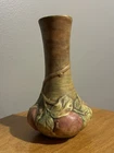 Weller Baldin - Red apples with green foliage on an earth toned brown vase.