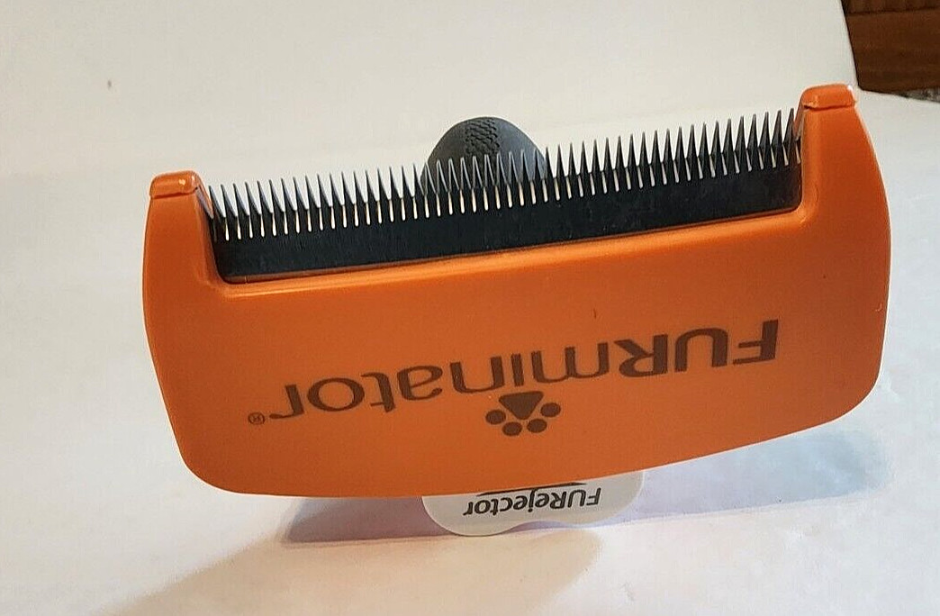 Dog grooming tool Furminator shedding puppy fur eliminator