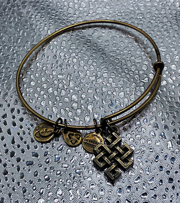 Alex and Ani Gold Tone Adjustable Wire Bangle Bracelet Knot Dangle Charm Signed