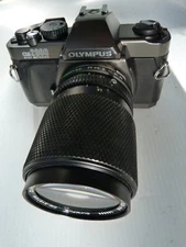 OLYMPUS OM2000 spot metering 35mm SLR Film Camera with 35-105/3.5-4.5 lens. READ